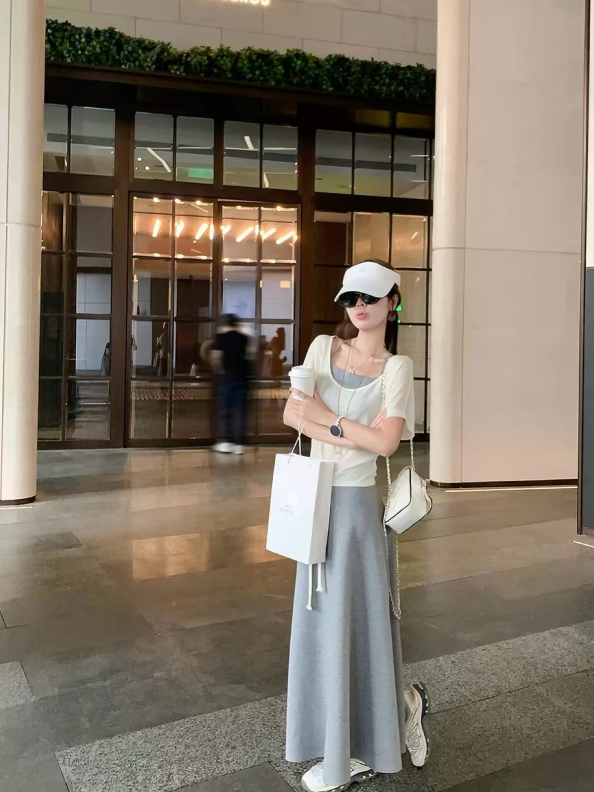 3-piece set full outfit - cream white knit top with grey camisole and A-line skirt, outdoor street style