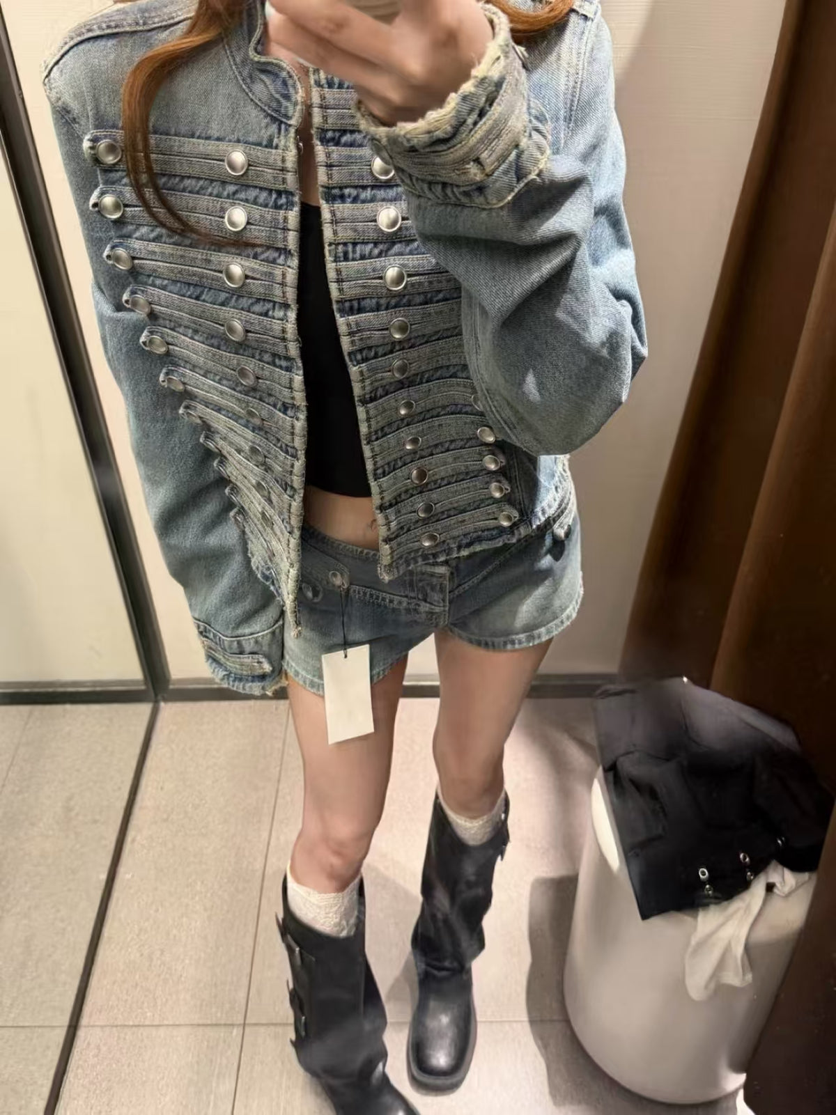 Black denim jacket – street style back view, model in urban setting