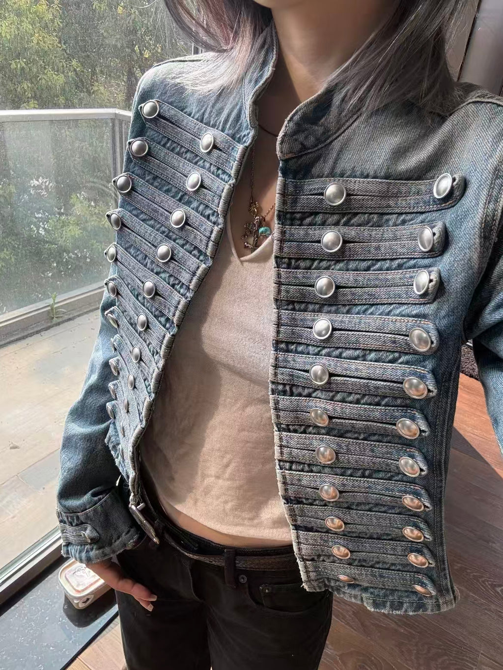 Light blue denim jacket – flat lay showing full front with silver button details