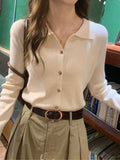 Camel polo collar knit cardigan - model wearing with white wide-leg pants