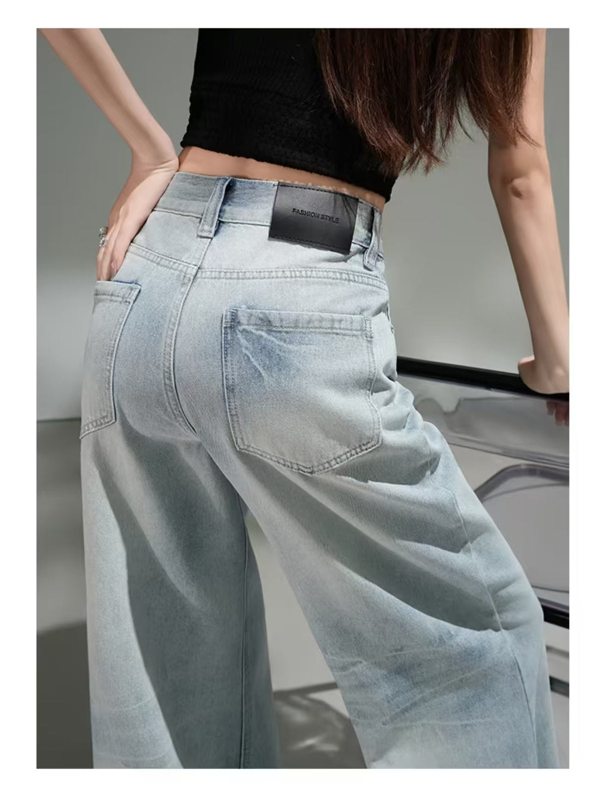 Styled lookbook shot – light blue jeans with black crop top